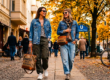 Two women walk past Kreuzberg Cafe and a Berlin U-Bahn sign.